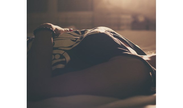 woman lying at the dark