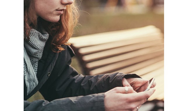 Girl sitting on the bench and waiting