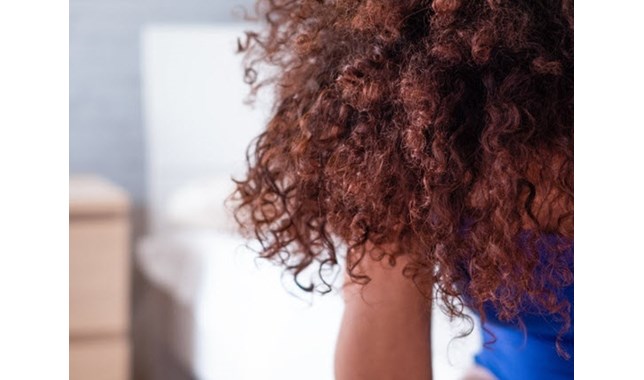 Woman holding her haead